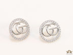 Platinum plated round cz earrings with twin G motif