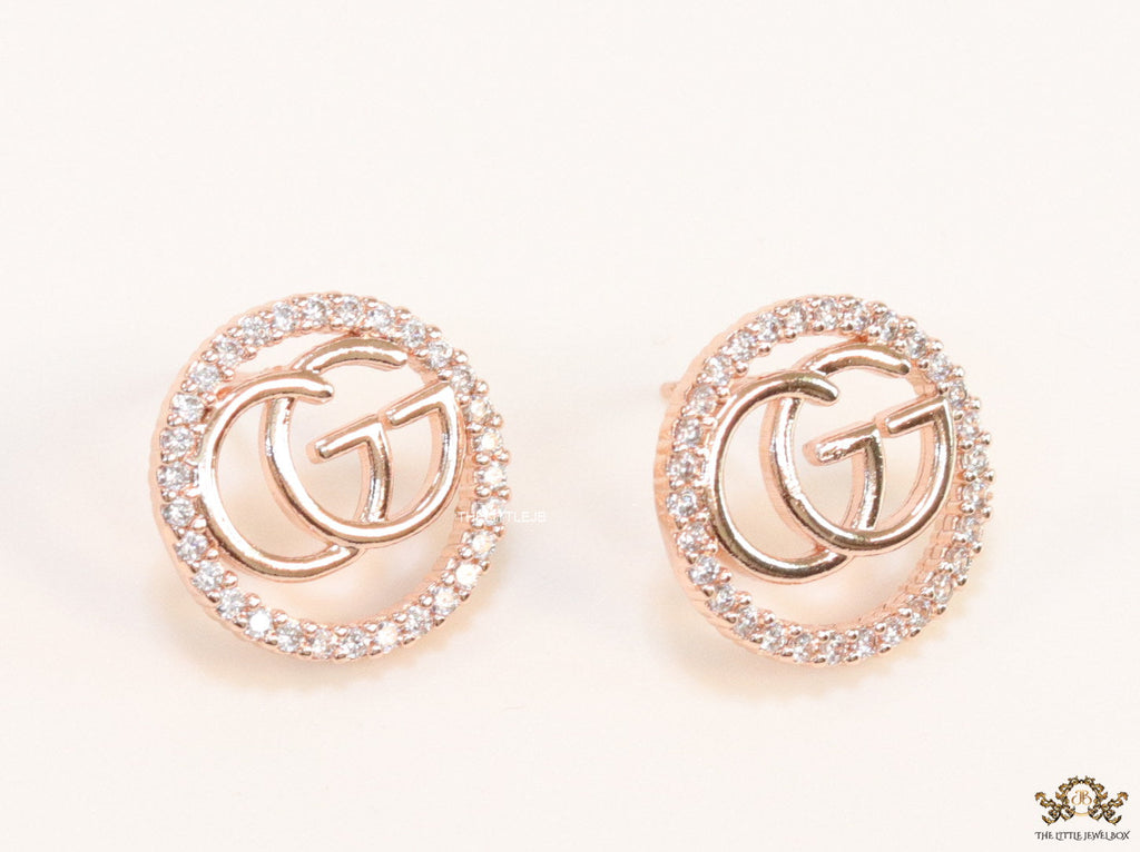 Rose gold plated round cz earrings with twin G motif