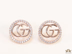 Rose gold plated round cz earrings with twin G motif