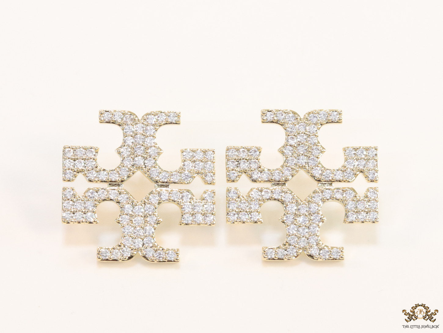 Gold plated twin T motif cz earrings