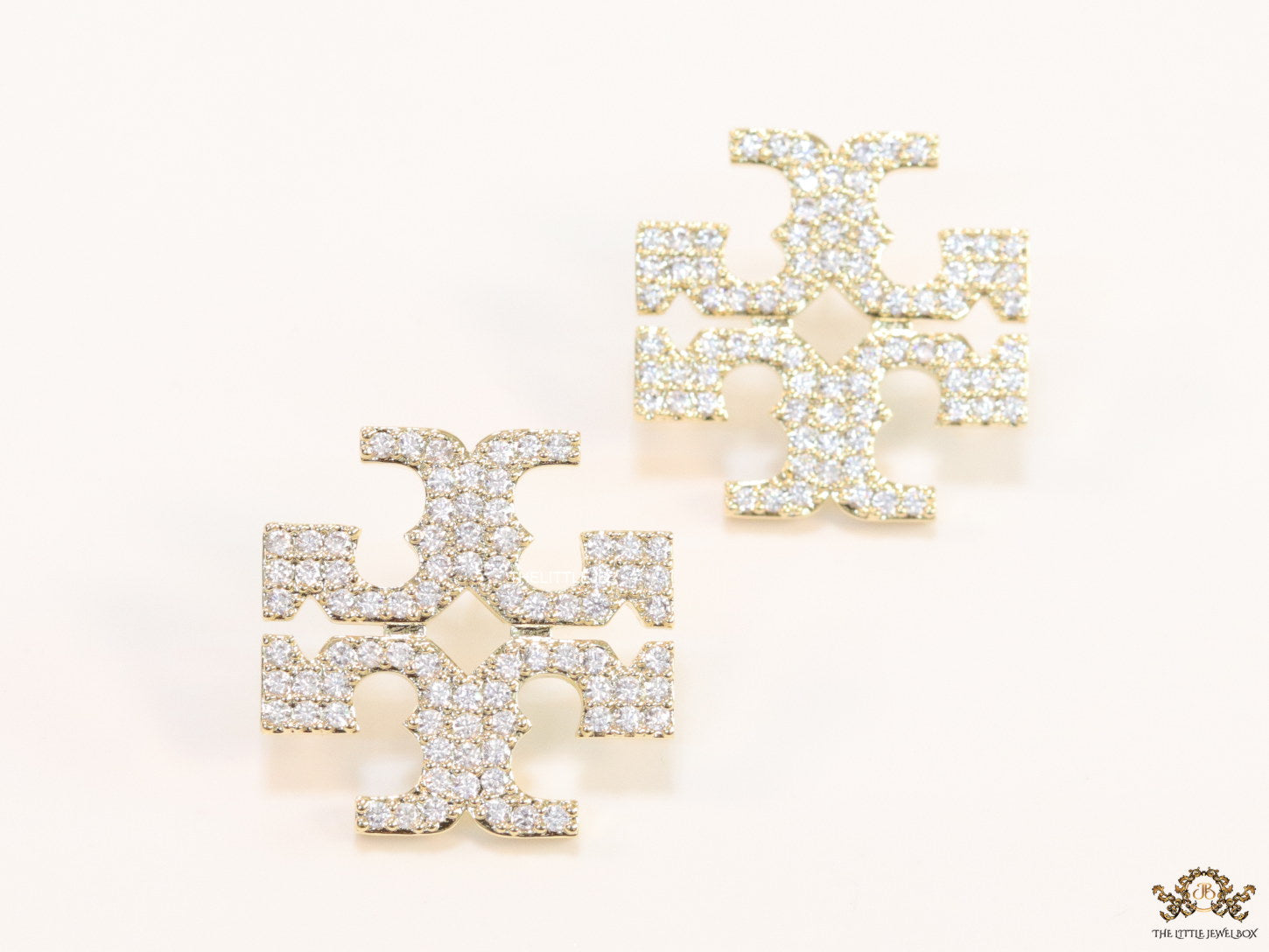 Gold plated twin T motif cz earrings