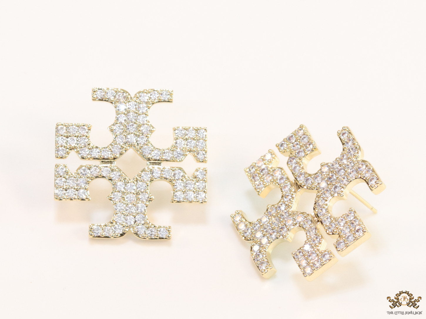 Gold plated twin T motif cz earrings