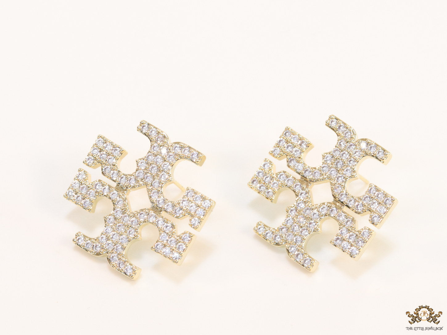 Gold plated twin T motif cz earrings