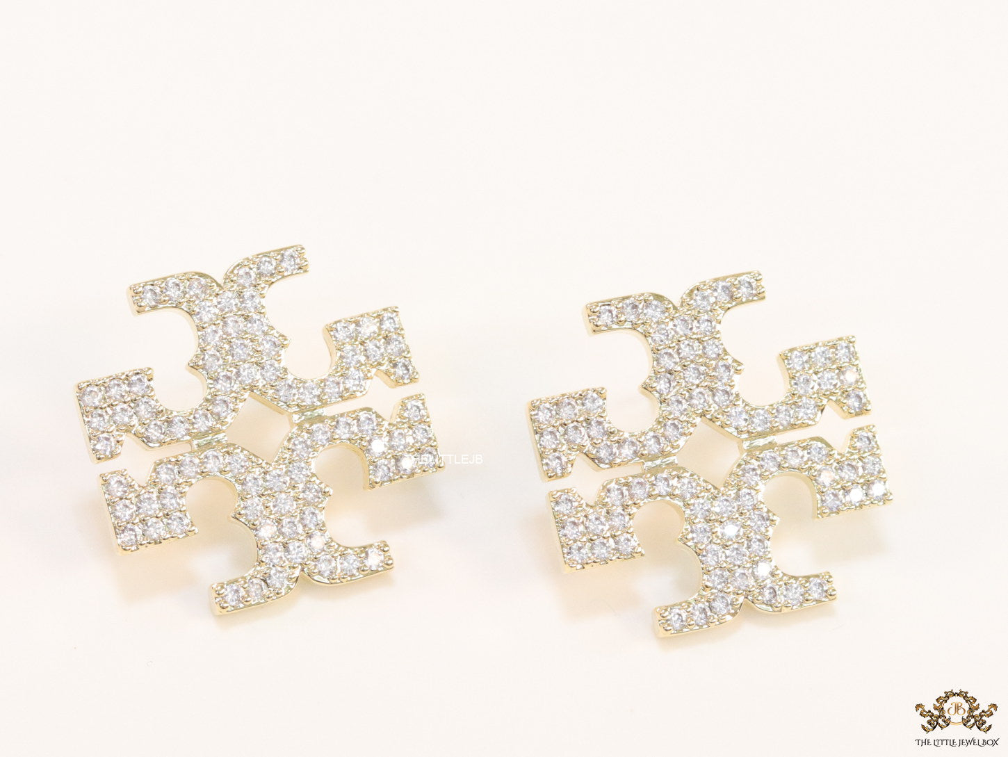 Gold plated twin T motif cz earrings