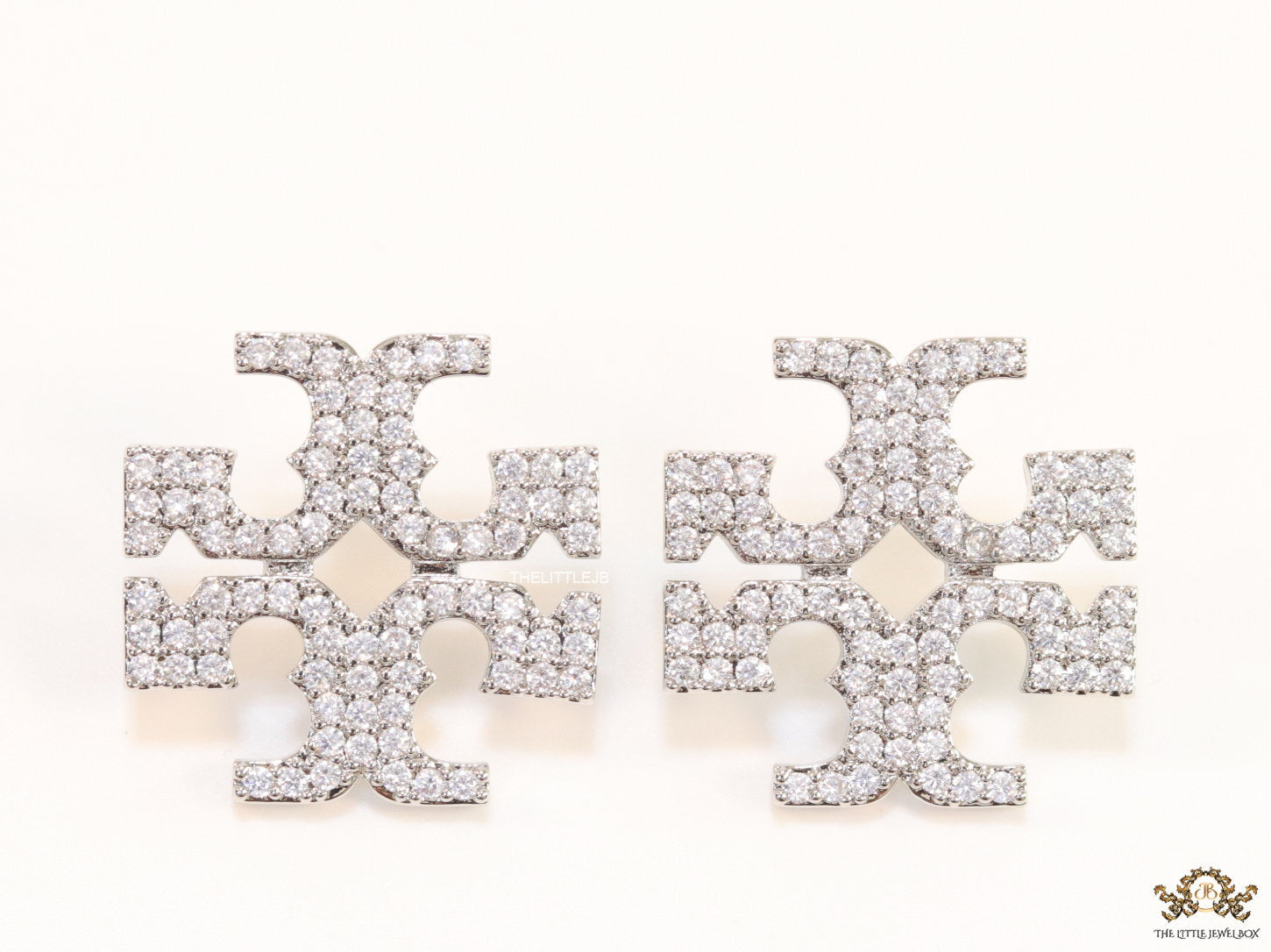 Platinum plated twin T motif cz earrings