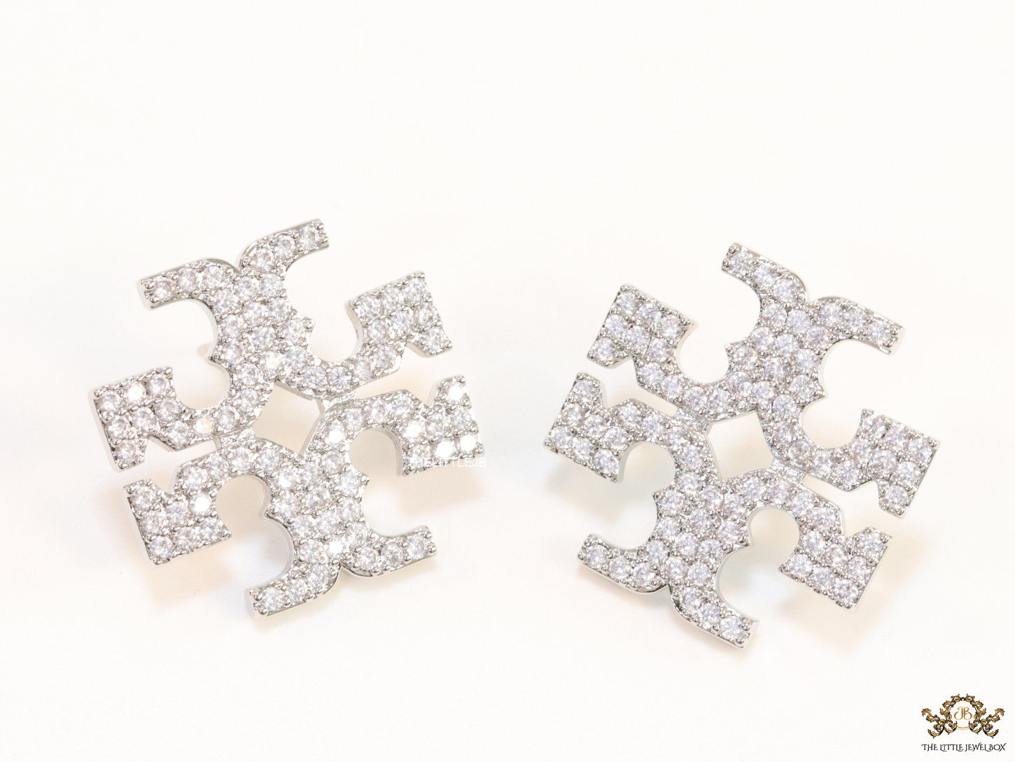 Platinum plated twin T motif cz earrings