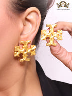 Gold earrings with T motifs matt finish clip ons