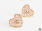 Light pink textured heart shaped studs with twin C motif in golden finish