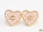 Light pink textured heart shaped studs with twin C motif in golden finish