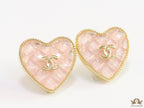 Light pink textured heart shaped studs with twin C motif in golden finish