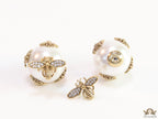 Designer pearl earrings with matte gold flying bee motifs