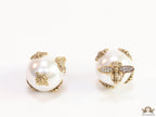 Designer pearl earrings with matte gold flying bee motifs