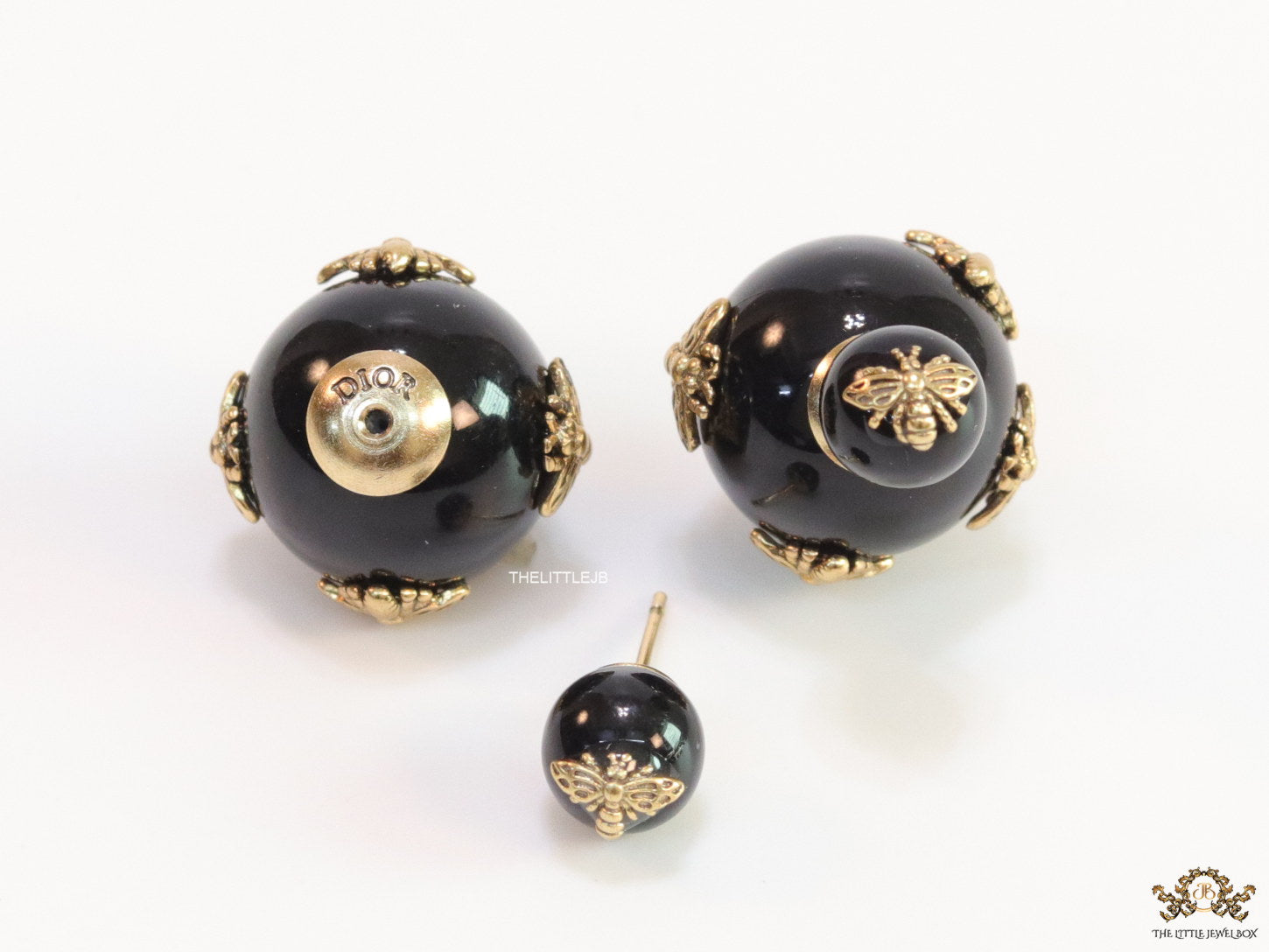 Designer pearl earrings with matte gold flying bee motifs
