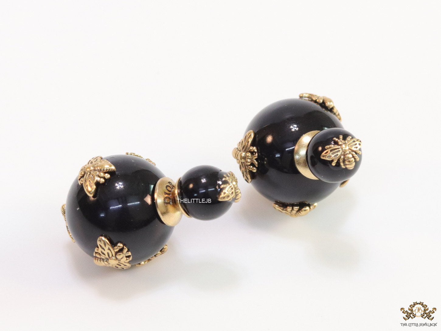 Designer pearl earrings with matte gold flying bee motifs