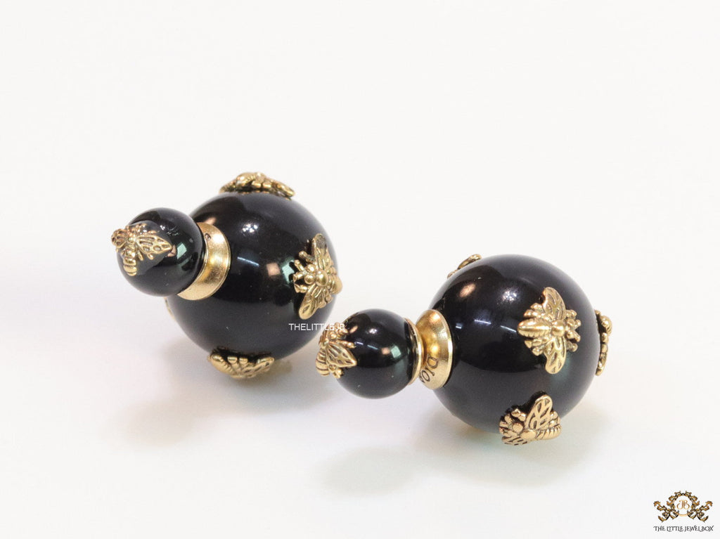 Designer pearl earrings with matte gold flying bee motifs