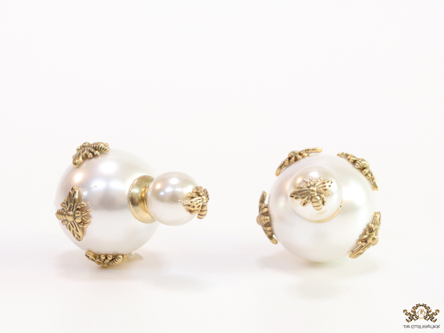 Designer pearl earrings with matte gold bee motifs