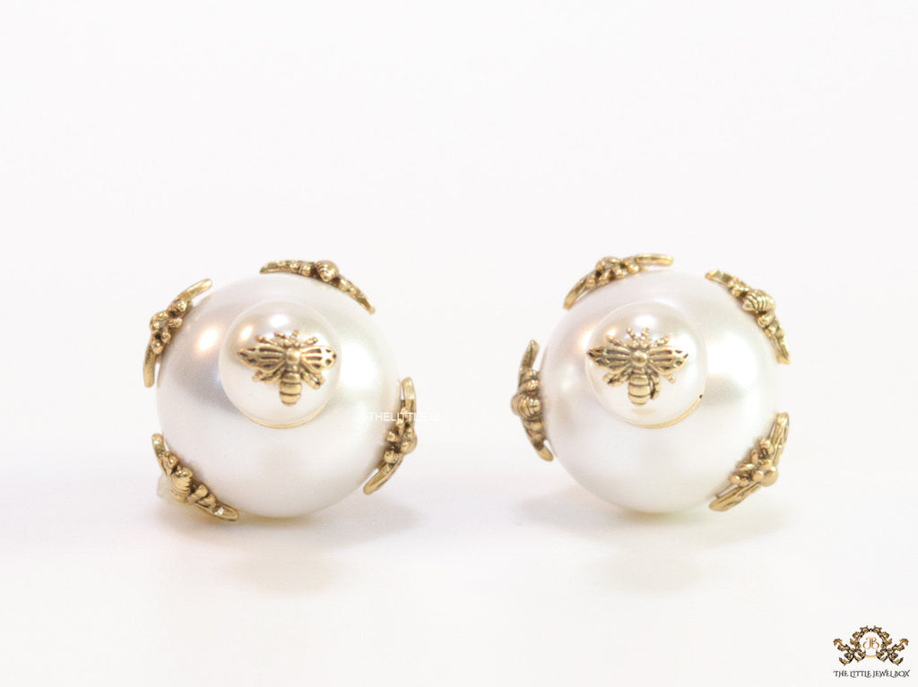 Designer pearl earrings with matte gold bee motifs
