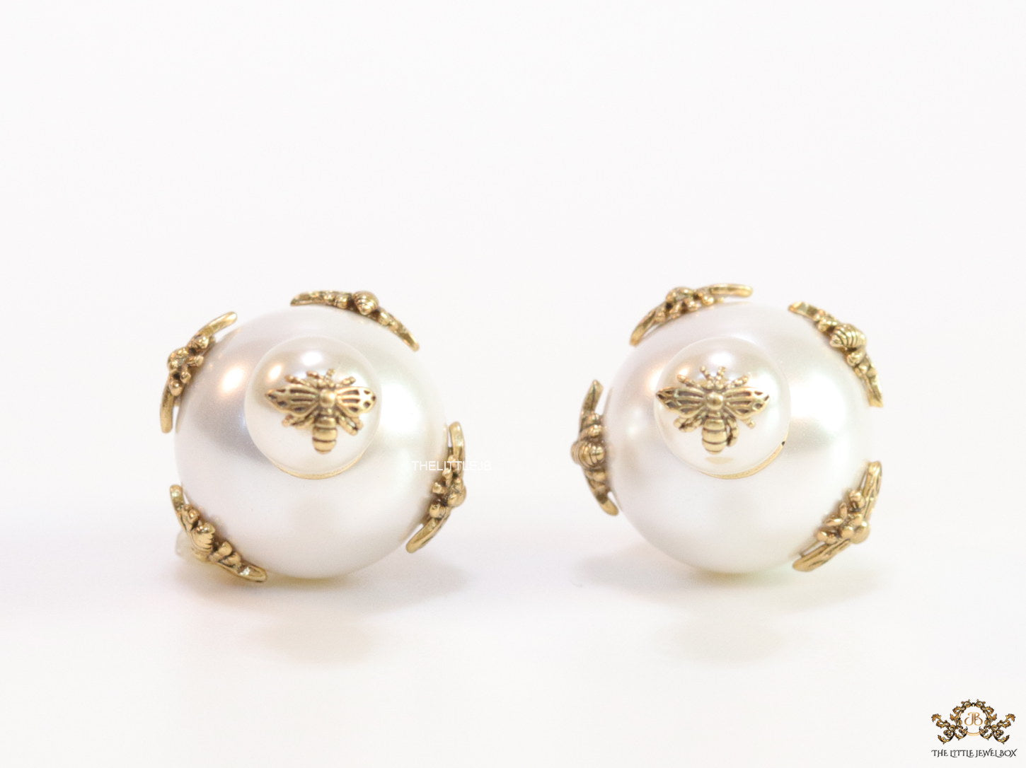 Designer pearl earrings with matte gold bee motifs