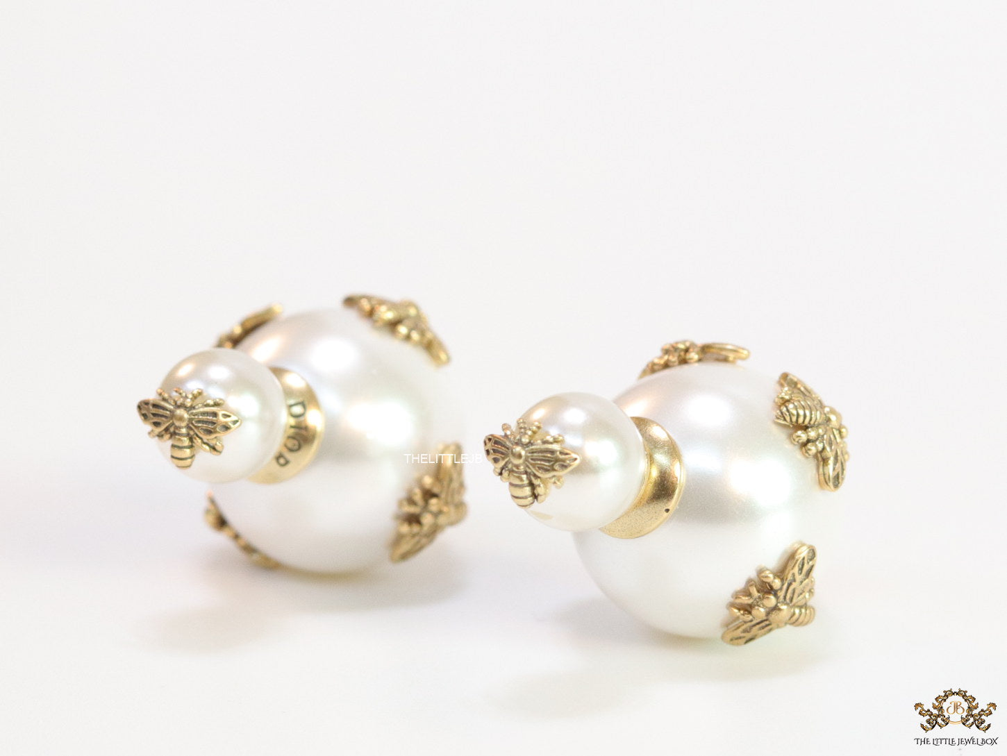 Designer pearl earrings with matte gold bee motifs