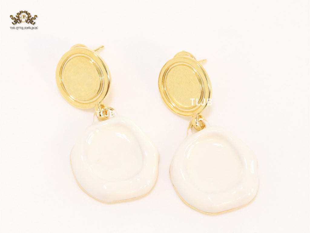 White enamel and gold earrings