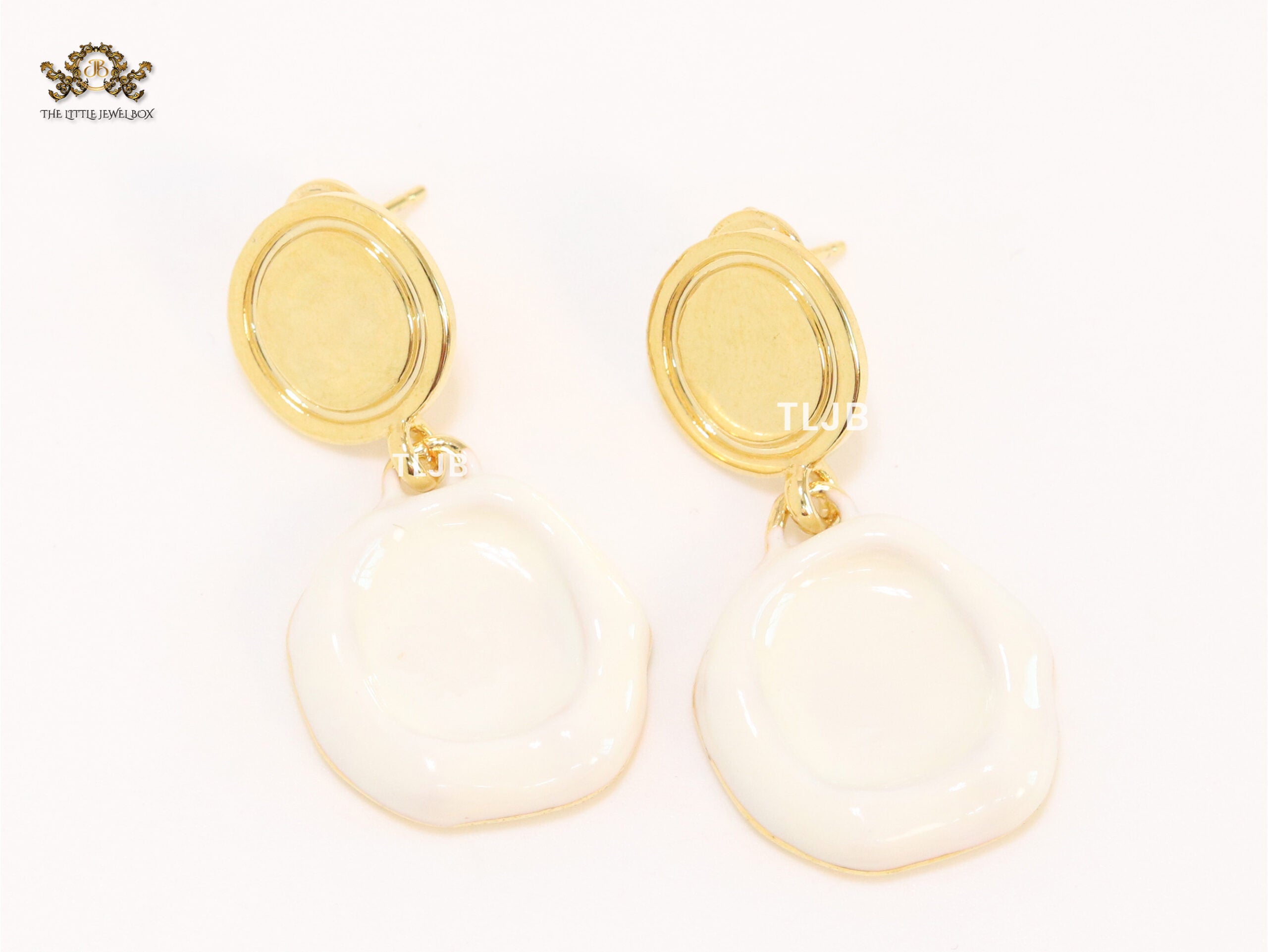 White enamel and gold earrings