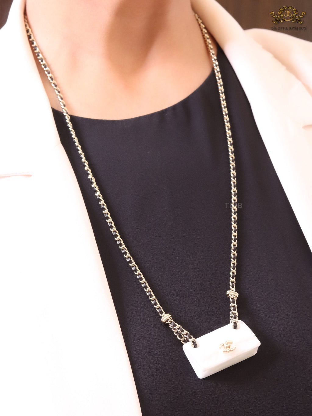 Double C enamel Bag on a black and gold chain