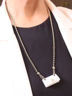 Double C enamel Bag on a black and gold chain