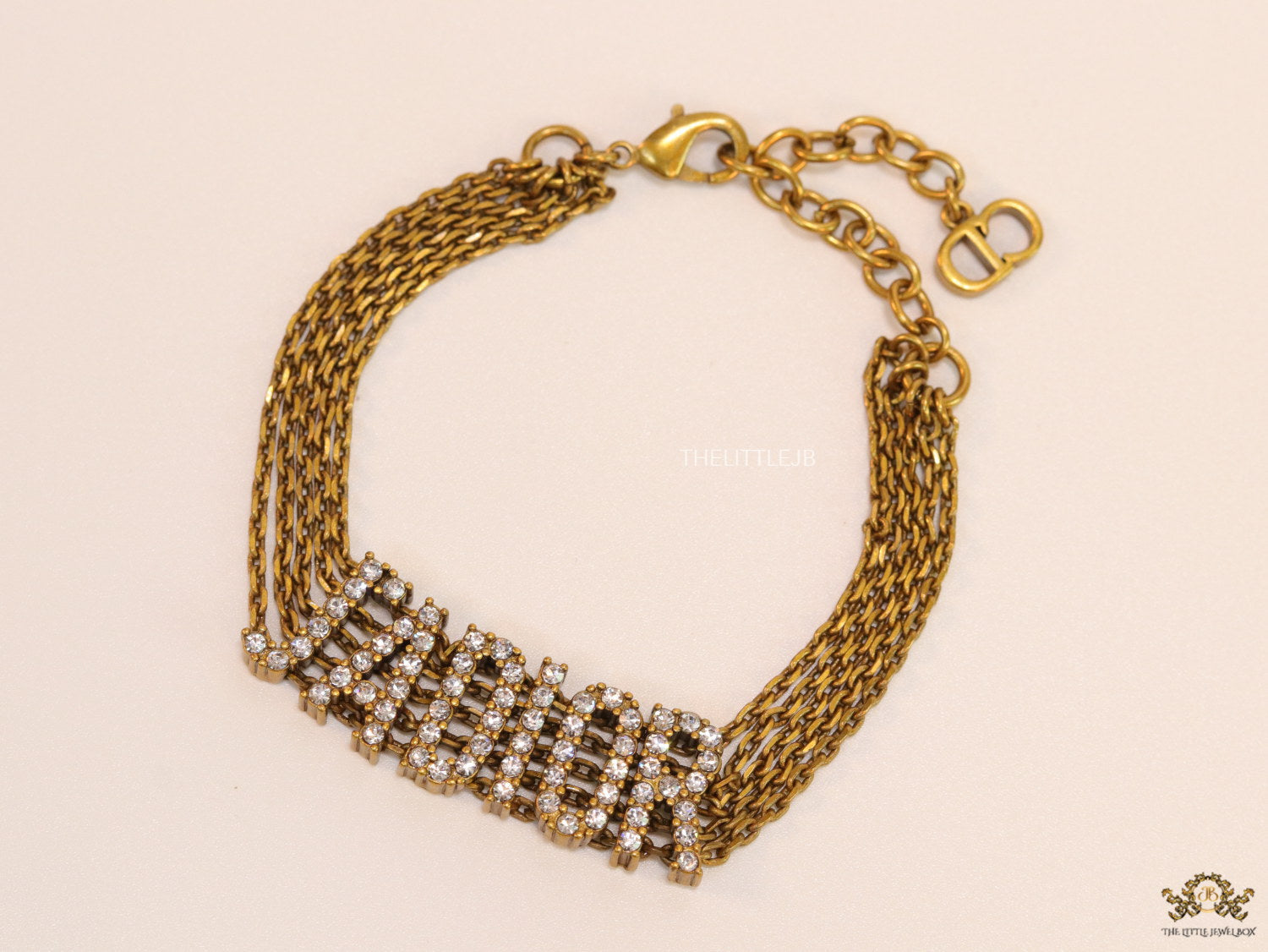 Multichain bracelet with cz alphabets in antique gold finish