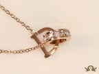 Rose gold plated D initial necklace with interlocking cz ring