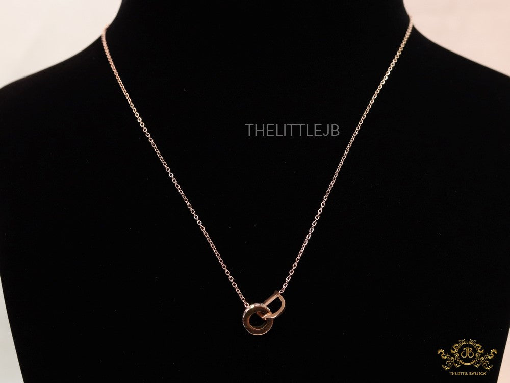 Rose gold plated D initial necklace with interlocking cz ring