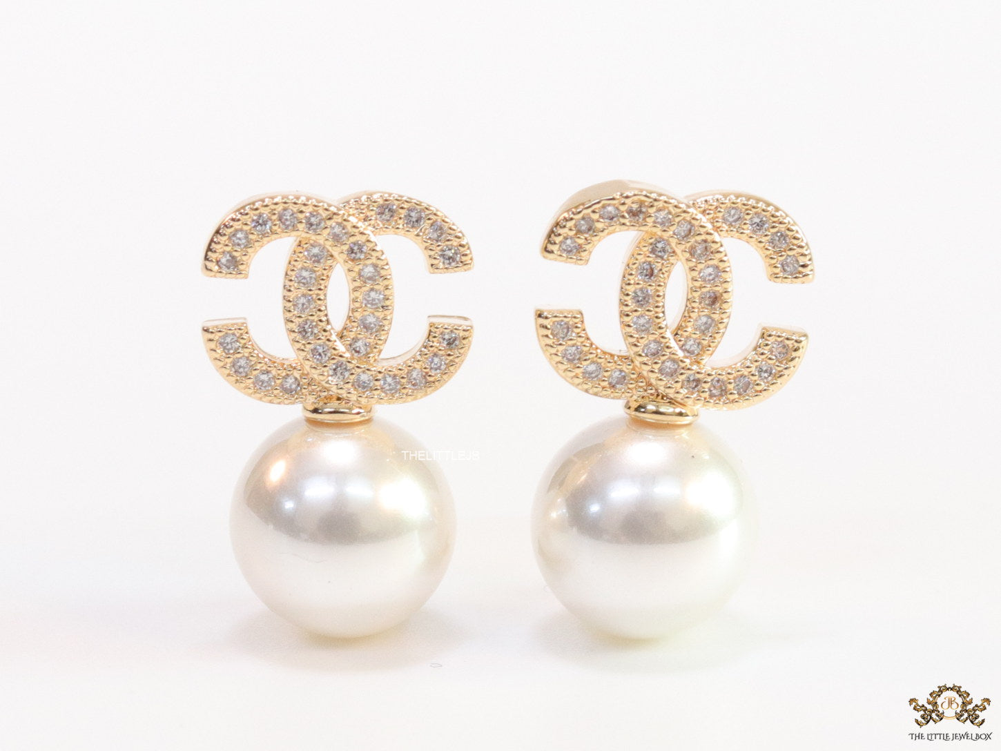 Twin C motif stud in gold and cz with pearl drop