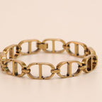 Openable golden Cand D motif bracelet