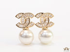 Golden cz baguettes studded twin C motif stud with pearl drop