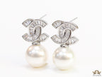 Platinum cz baguettes studded twin C motif stud with pearl drop