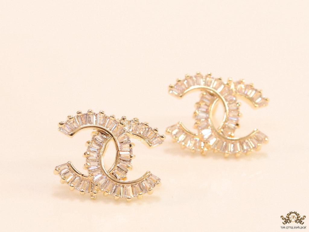 Gold plated twin C motif studs in cz baguettes