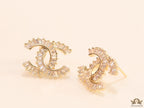 Gold plated twin C motif studs in cz baguettes