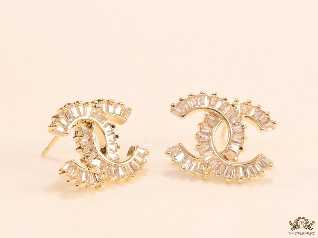 Gold plated twin C motif studs in cz baguettes