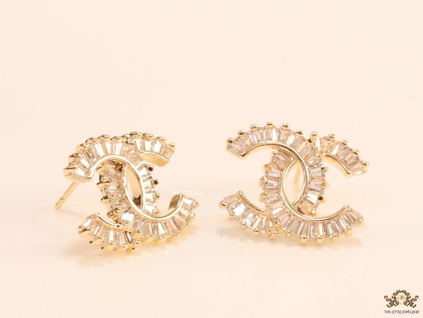 Gold plated twin C motif studs in cz baguettes