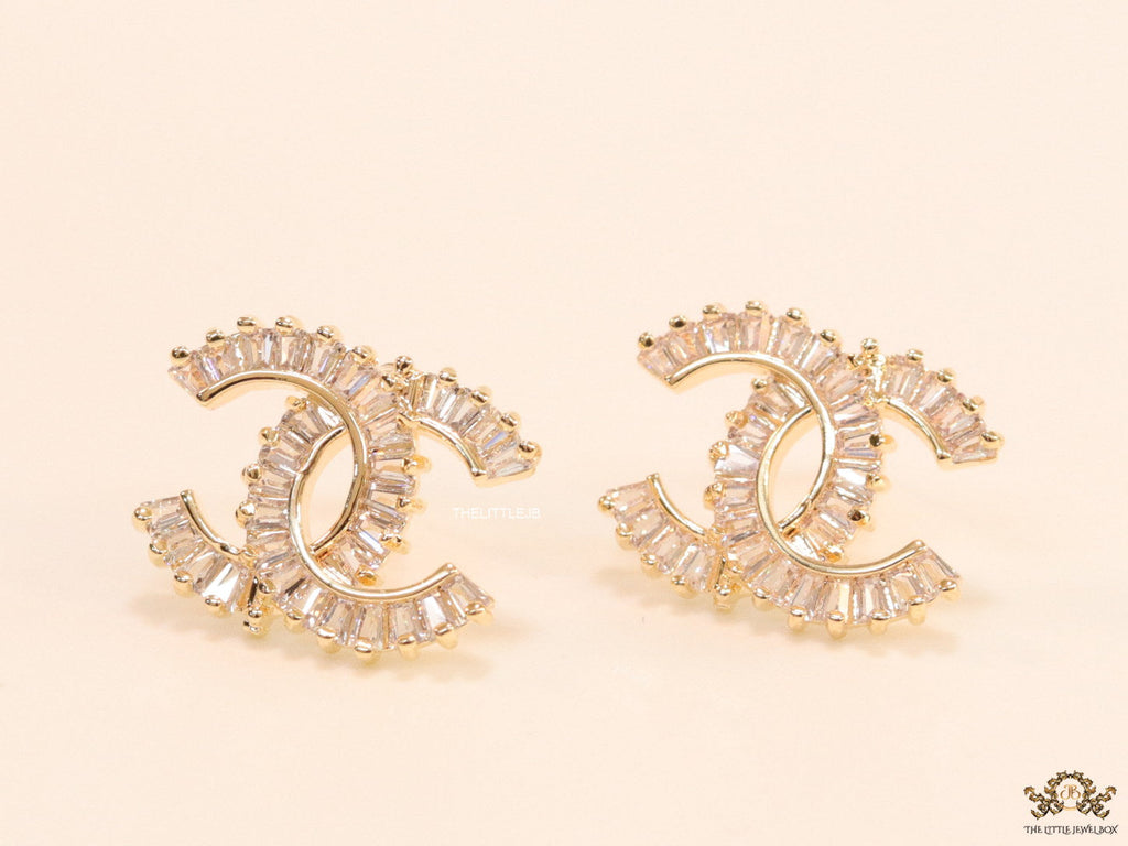 Gold plated twin C motif studs in cz baguettes