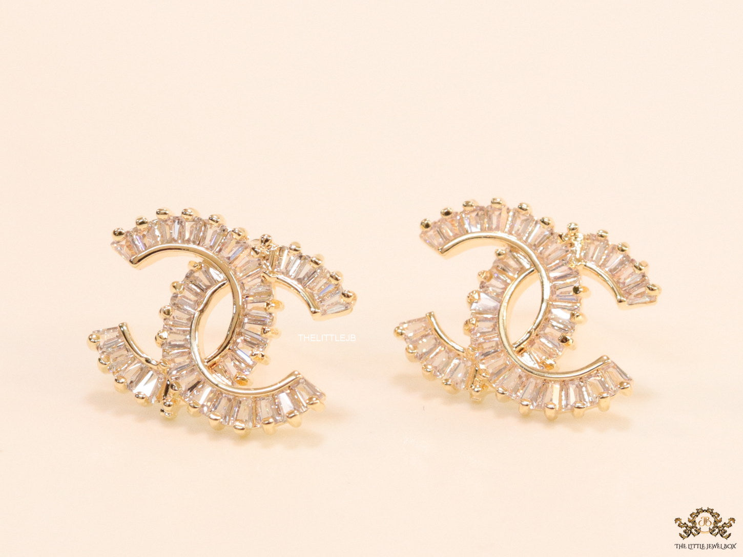Gold plated twin C motif studs in cz baguettes