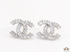 Platinum plated twin C motif studs in cz baguettes