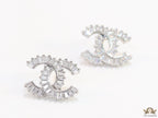 Platinum plated twin C motif studs in cz baguettes