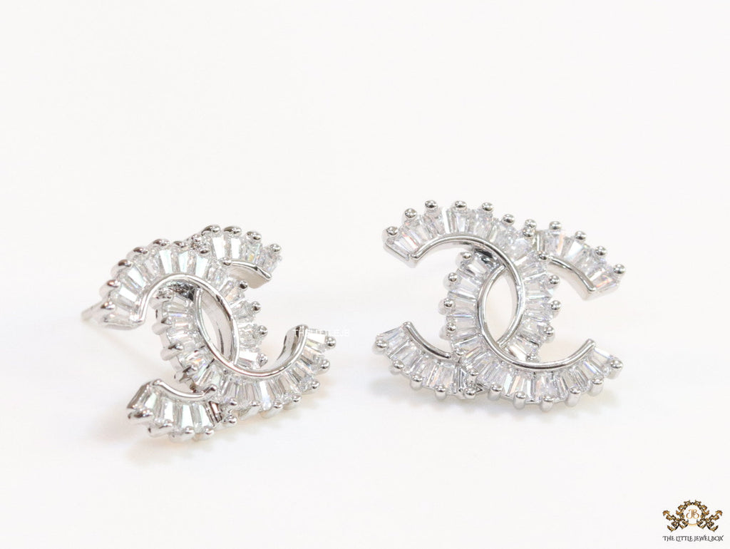Platinum plated twin C motif studs in cz baguettes