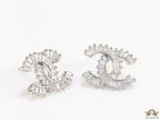 Platinum plated twin C motif studs in cz baguettes