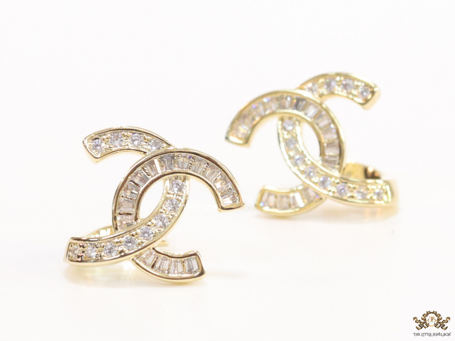 Gold plated twin C motif studs in cz and baguettes