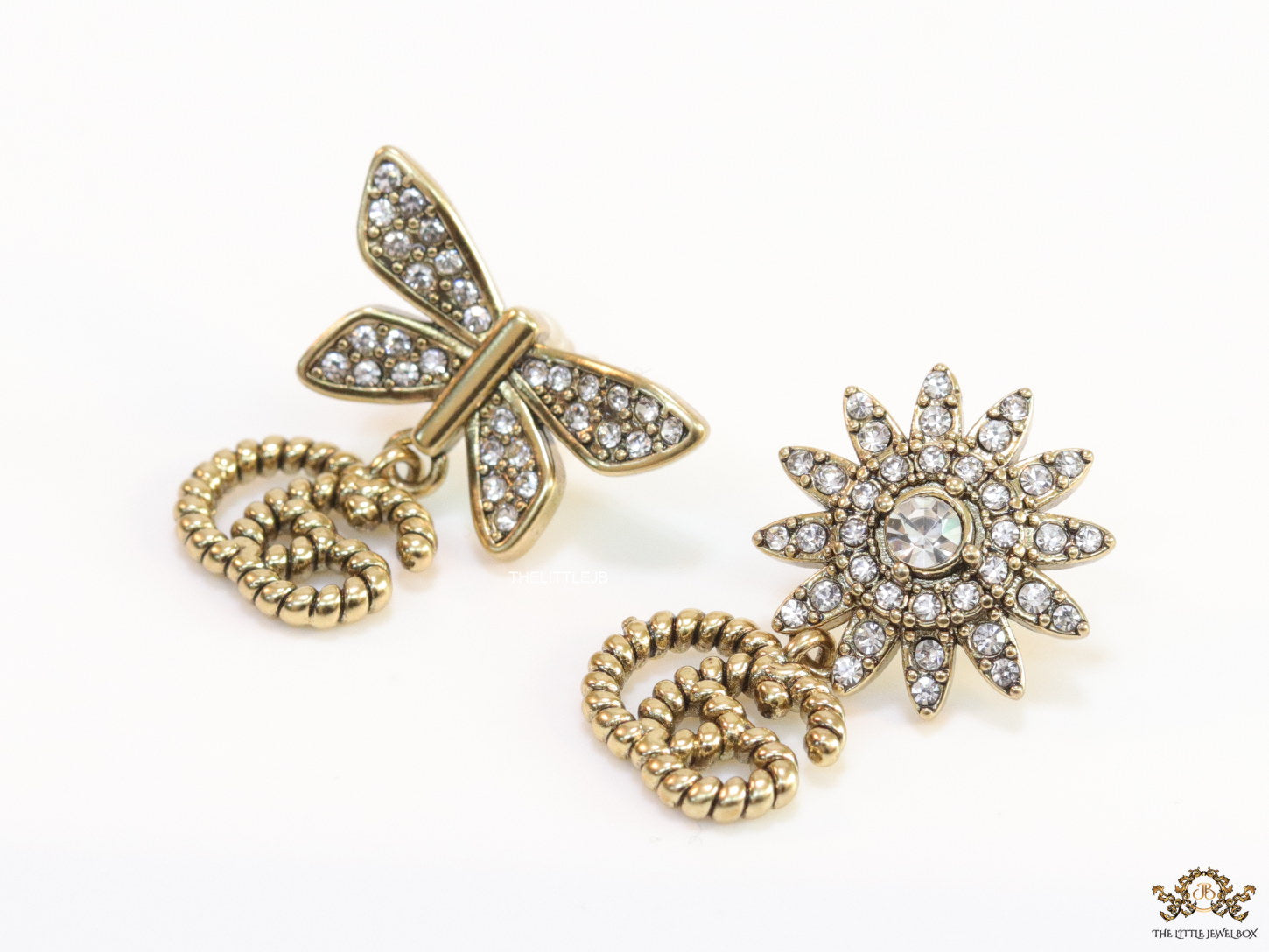 Flower and butterfly cz earrings in antique gold with twin G drops