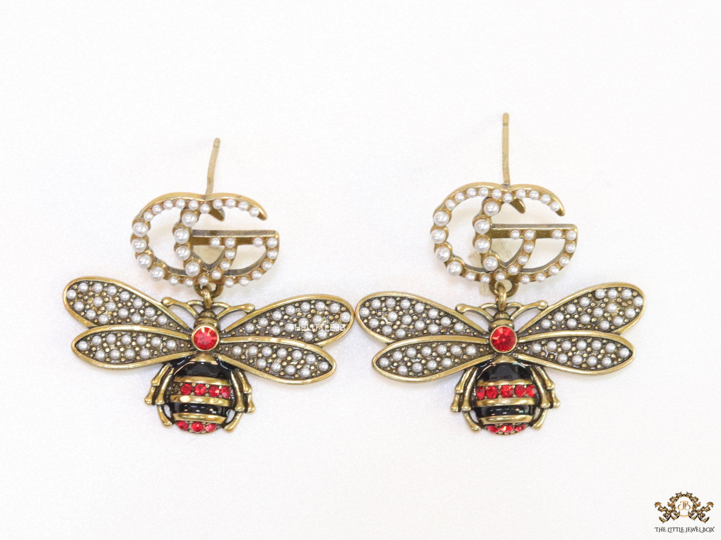 Gold plated twin G cz earrings with honey bee motif drop