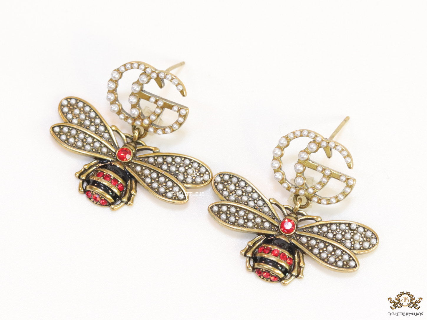 Gold plated twin G cz earrings with honey bee motif drop