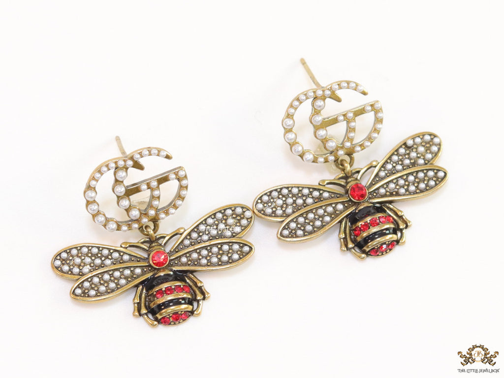 Gold plated twin G cz earrings with honey bee motif drop