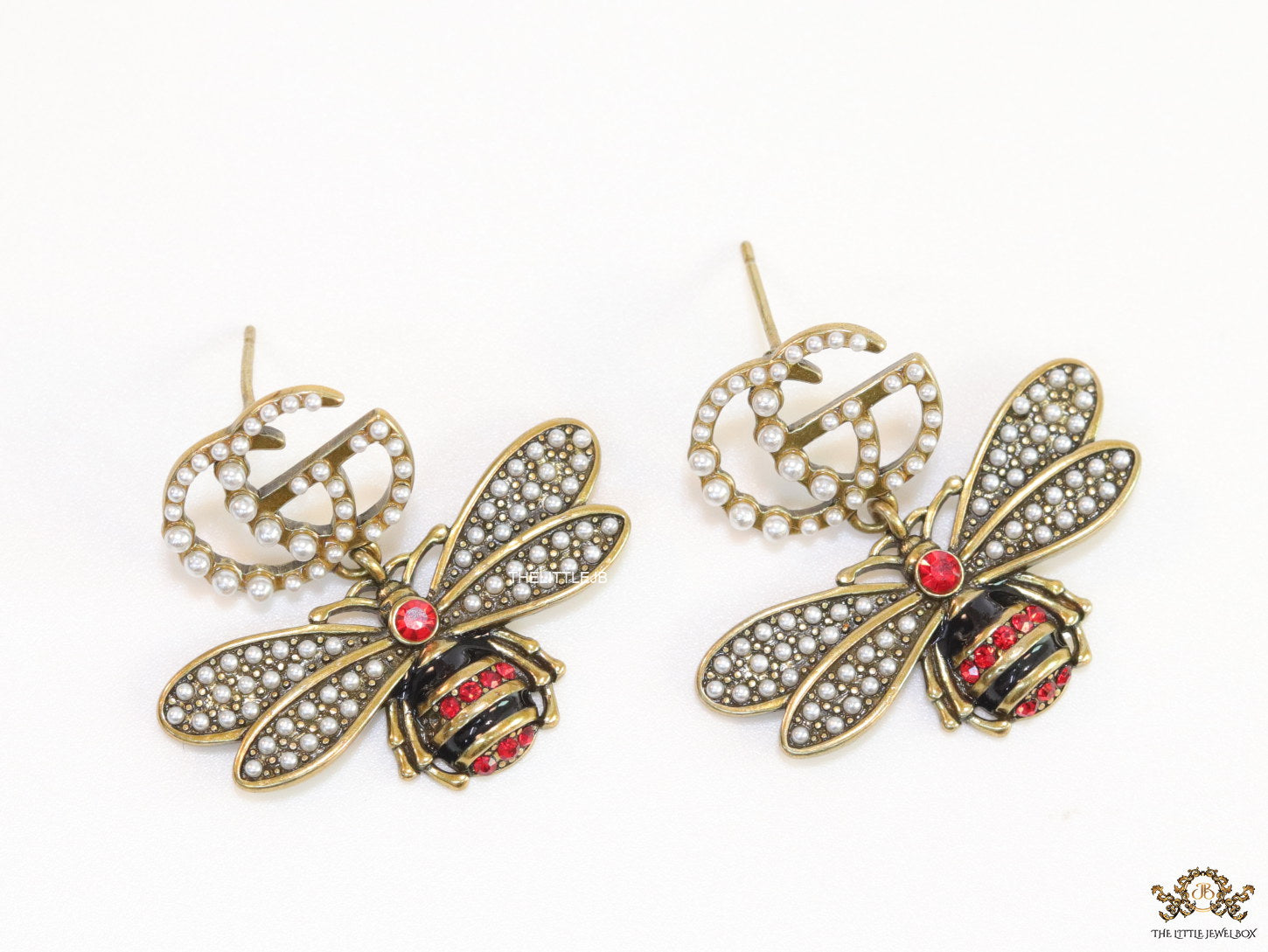 Gold plated twin G cz earrings with honey bee motif drop